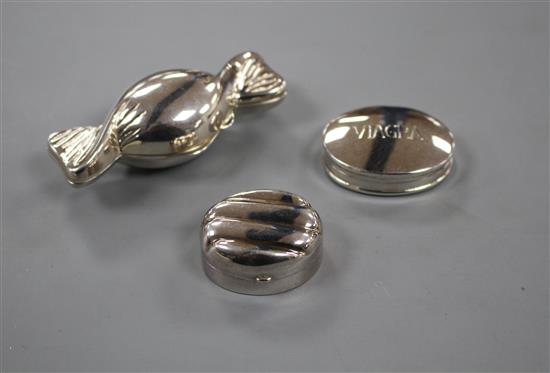 Three assorted modern silver pill boxes, including one modelled as a sweet and one engraved Viagra,